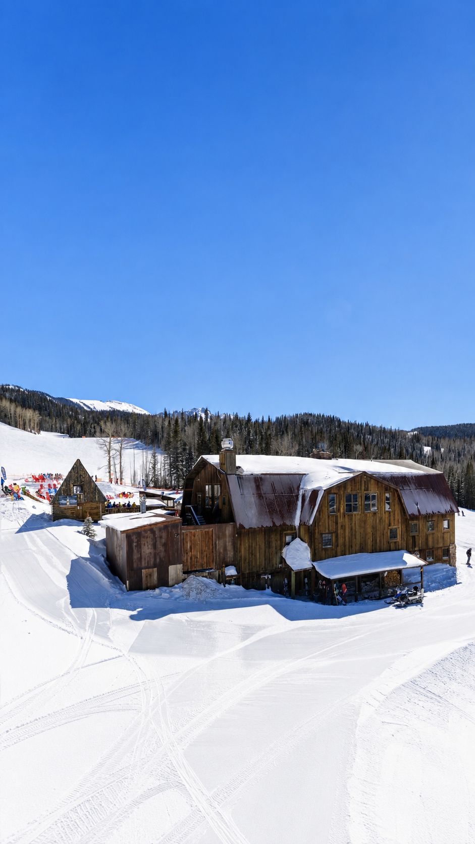 Historic Gorrono Ranch at Telluride Ski Resort surrounded by snow and the San Juan Mountains